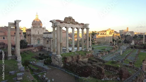 Wonderful panoramic view at sunset in ancient Roman forum remains of Temples and historical structures inherited heritage from Roman Empire age