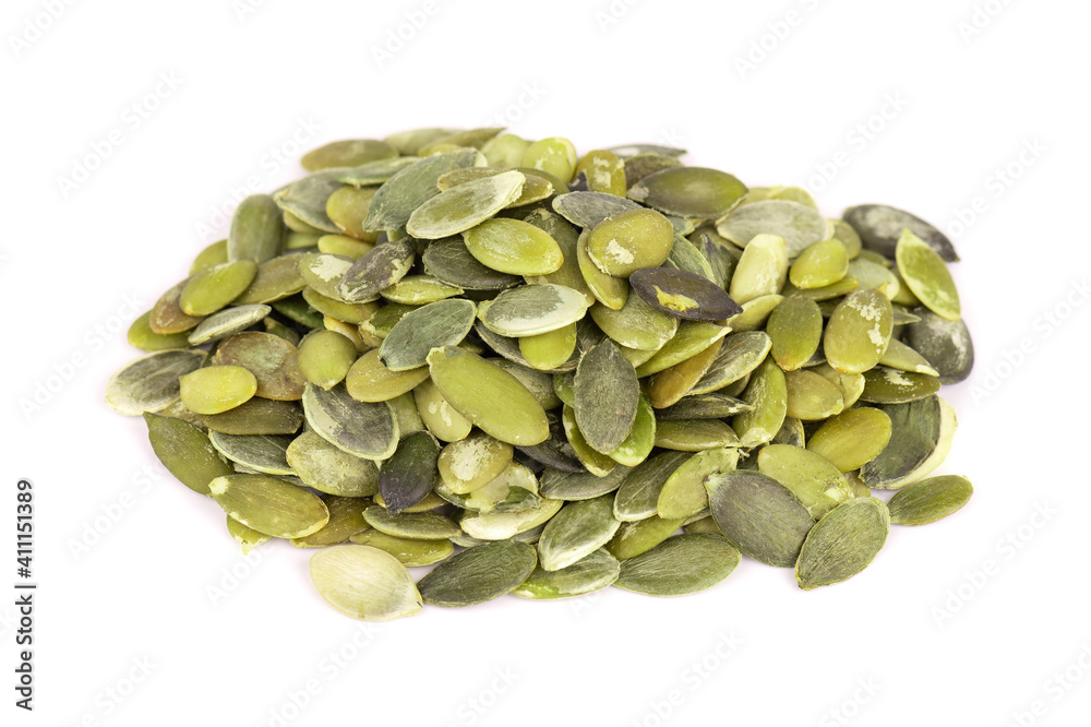 Pumpkin seeds isolated on white background. Green pepita seeds. Pumpkin seeds isolated on white background. Green pepita seeds.