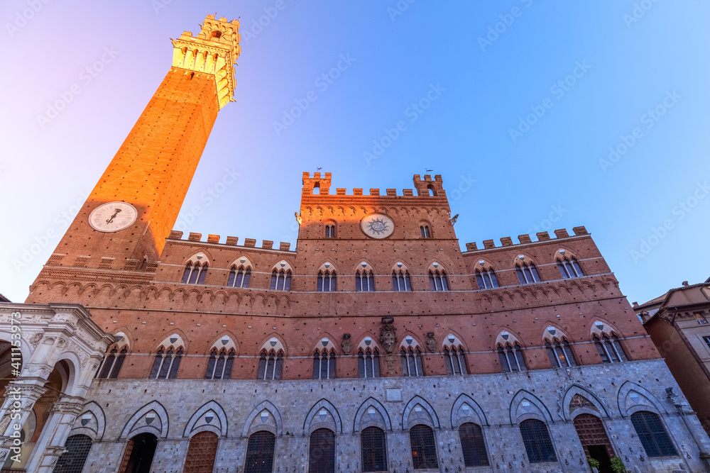 Palazzo Pubblico In the last rays of the setting sun. Siena, Tuscany, Italy