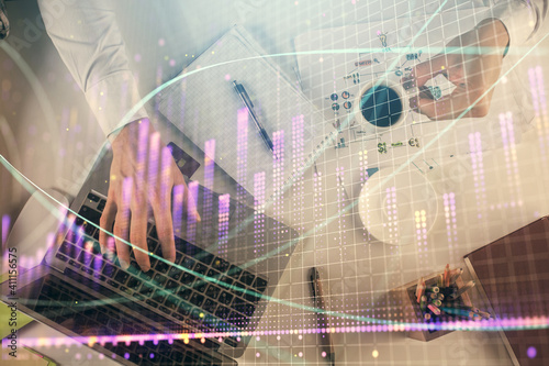 Wallpaper Mural Multi exposure of man's hands typing over computer keyboard and forex graph hologram drawing. Top view. Financial markets concept. Torontodigital.ca