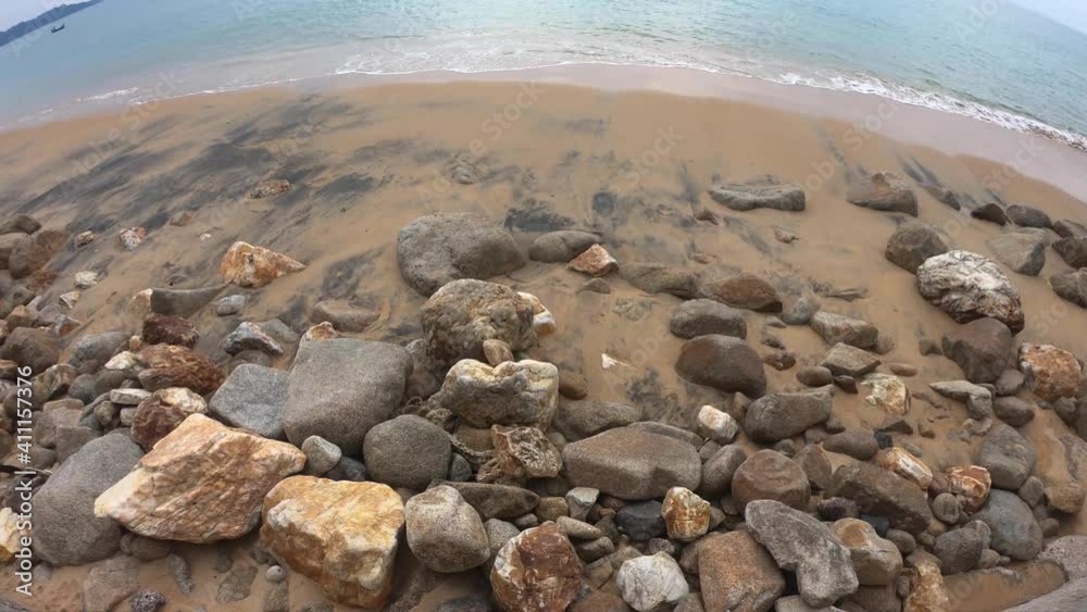 beautiful stony beach in tropical sea. color and texture of big rocks ...