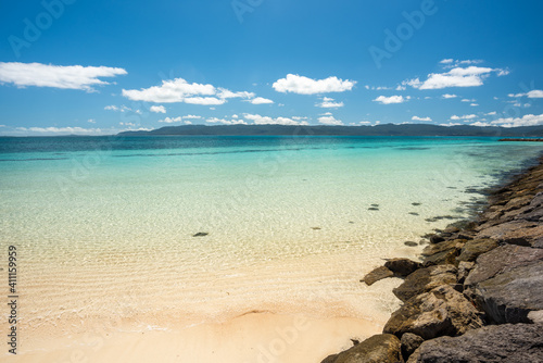 Blue transparent waters on a sunny day on the pristine island of hatoma, Japan. photo