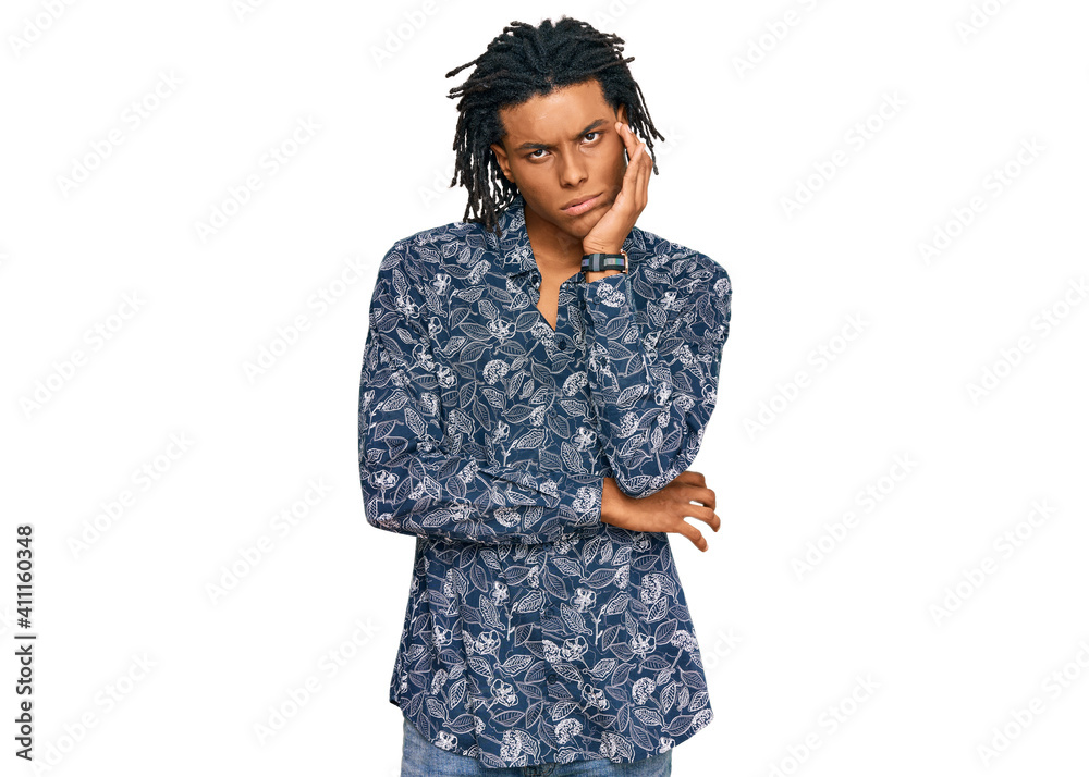 Young african american man wearing 80s shirt thinking looking tired and bored with depression problems with crossed arms. Young african american man wearing 80s shirt thinking looking tired and bored with depression problems with crossed arms.