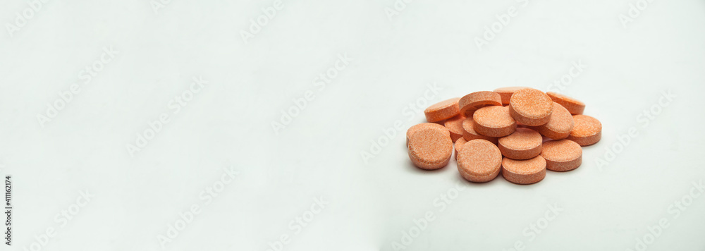 pills on a gray background. medicinal capsules on the table. treatment concept. many vitamins pills on a gray background. medicinal capsules on the table. treatment concept. many vitamins