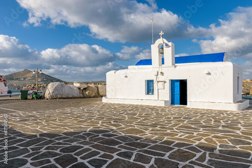 View of the traditional christian church of Saint Nicholas on the pictursque harbor of  Naousa in  Paros island, Greece. photo