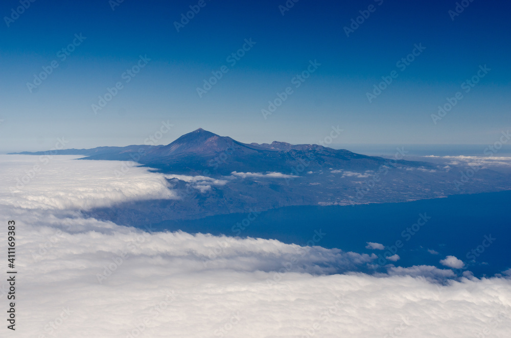 Aerial view of the Pico de Teide volcano emerging from clouds, Tenerife Aerial view of the Pico de Teide volcano emerging from clouds, Tenerife