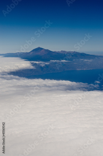Aerial view of the Pico de Teide volcano emerging from clouds, Tenerife © Tomas Zavadil