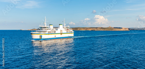 Ferry connecting the island of Malta and the island of Goro, passing in front of the island of Comino, in the Maltese archipelago photo