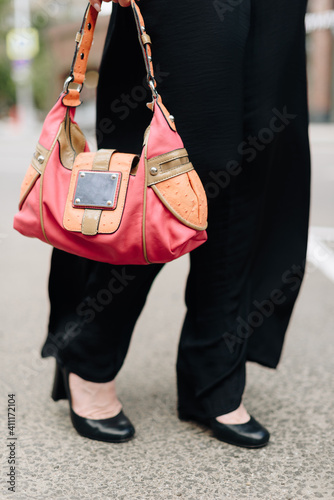 A woman with a bag on the background of the city