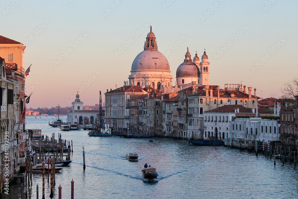 Venice, Italy - winter 2020: view on Grand Canal and Basilica della Salute during sunset
