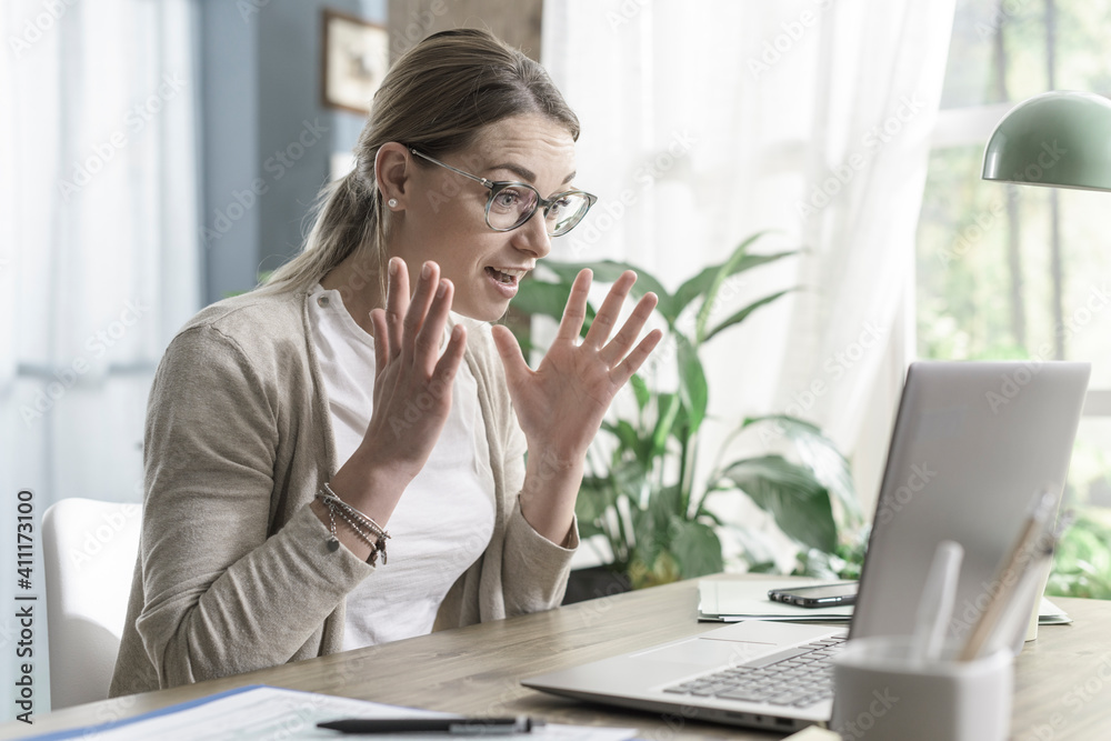 Happy woman receiving a beautiful surprise online