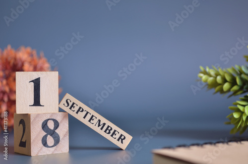 September 18, Cover in the evening time, Date Design with number cube for a background.