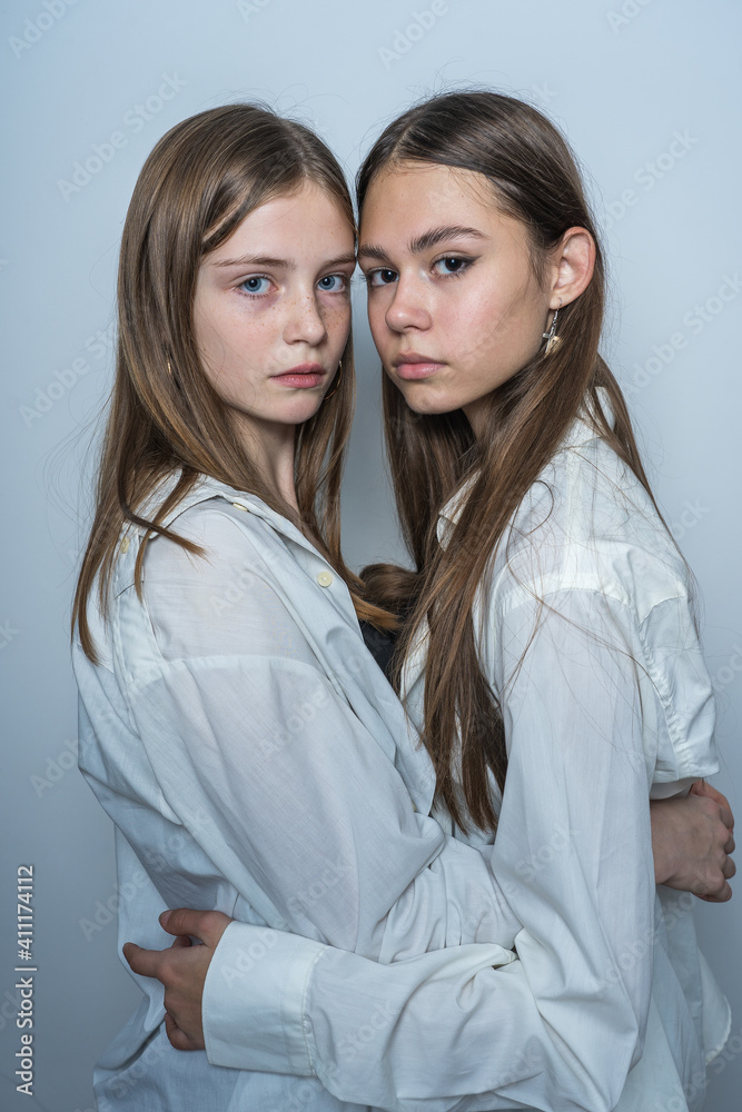 Portrait of two beautiful young girls, close up Portrait of two beautiful young girls, close up