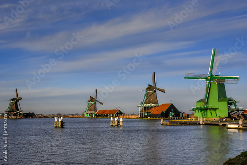 Ditch windmills in traditional colors at the Zaanse Schans, Holland.
