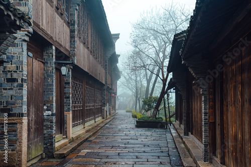 WUZHEN,CHINA-MARCH 6,2012: Ancient buildings along the canal. Morning fog over the city.