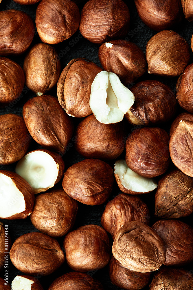 Fototapeta premium Close up of Hazelnut kernels - Food Frame Background, macro detailed close up.