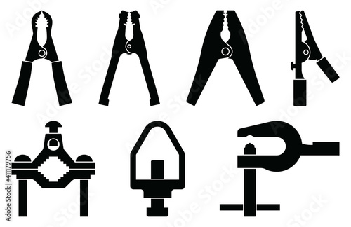 Alligator clip and clamp. Electrical tools. Silhouette vector