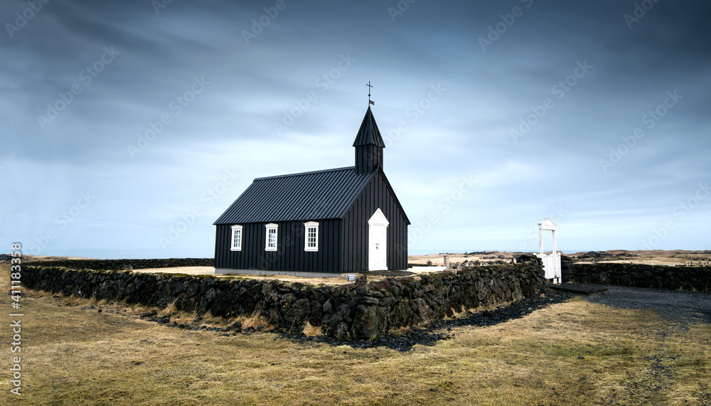 Black church of Budir at Snaefellsnes peninsula region in Iceland. Stormy cloudy sky at winter Black church of Budir at Snaefellsnes peninsula region in Iceland. Stormy cloudy sky at winter
