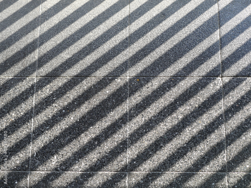 Fototapeta premium The sun light abstract shadow over the gray concrete ,sunshade shadow.
