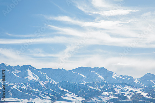 landscape snowy mountains with blue sky and clouds