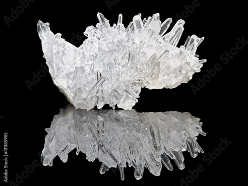 Amazing pure Quartz Crystal cluster gemstone closeup macro isolated on black background. Natural rare white mineral rough stone. Beautiful crystals arrangement