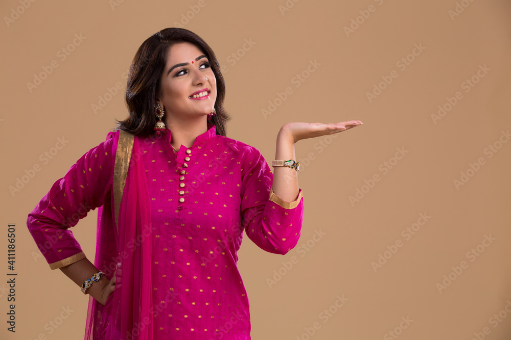 woman looking sideways with open hand woman looking sideways with open hand