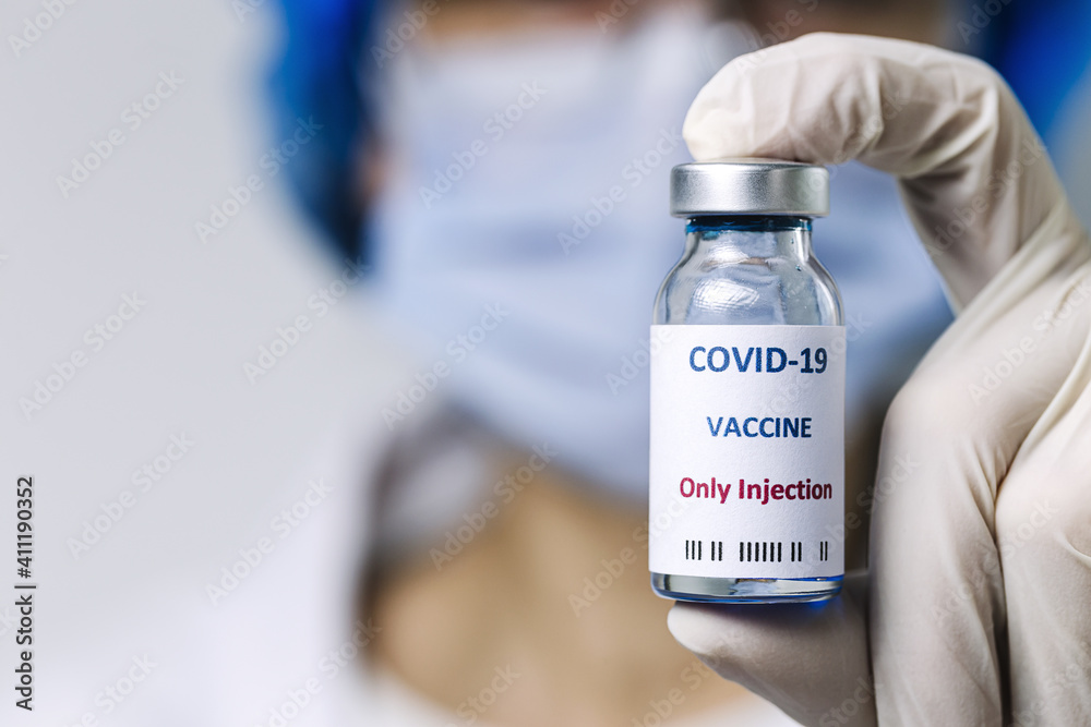 COVID-19 vaccine in researcher hands, unrecognizable female doctor holds syringe COVID-19 vaccine in researcher hands, unrecognizable female doctor holds syringe