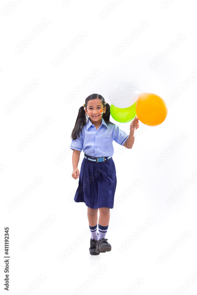 young school girl holding balloons in her hand , independence day young school girl holding balloons in her hand , independence day