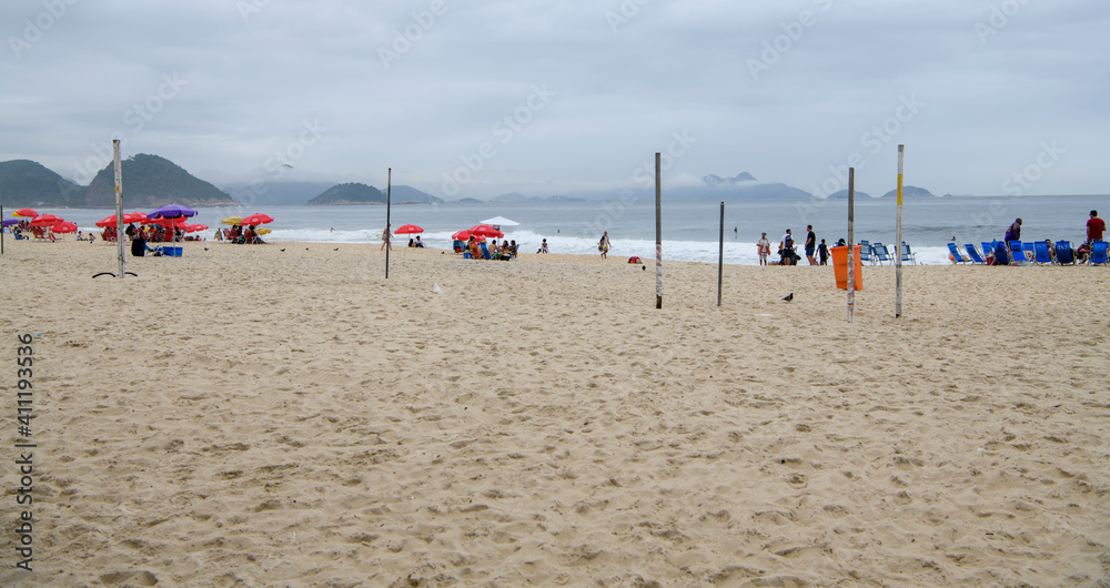 Citizens swim and sunbathe on the beach of Copacabana Citizens swim and sunbathe on the beach of Copacabana