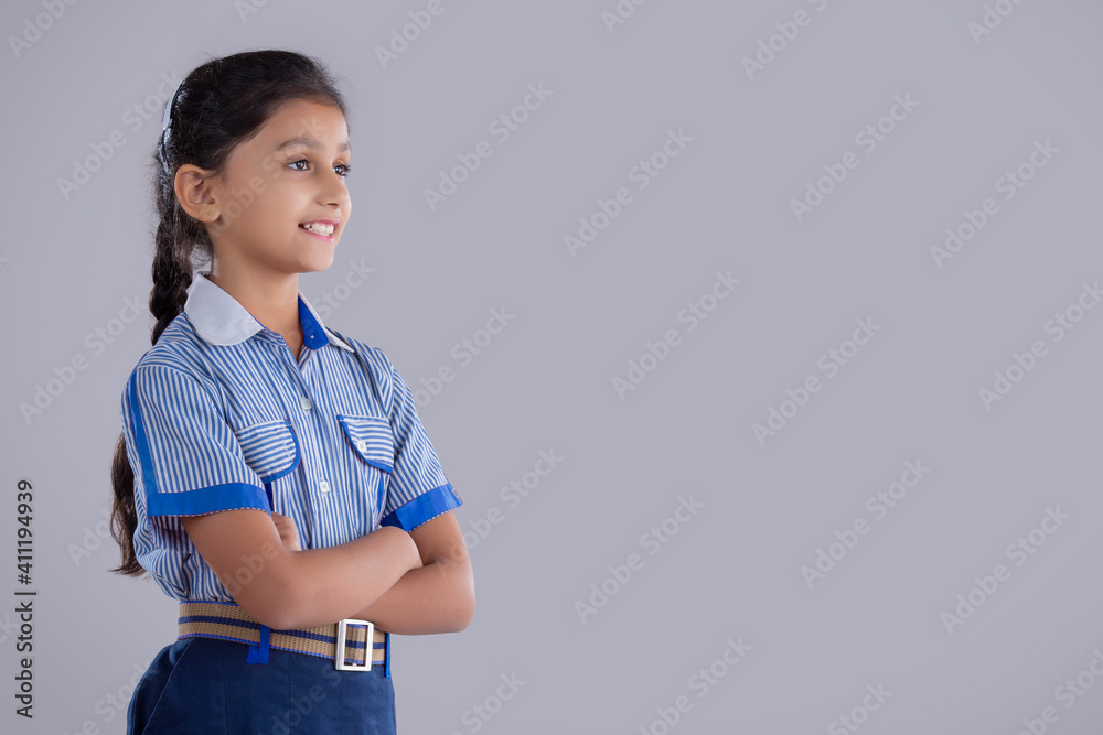 portrait of a school girl smiling at something portrait of a school girl smiling at something