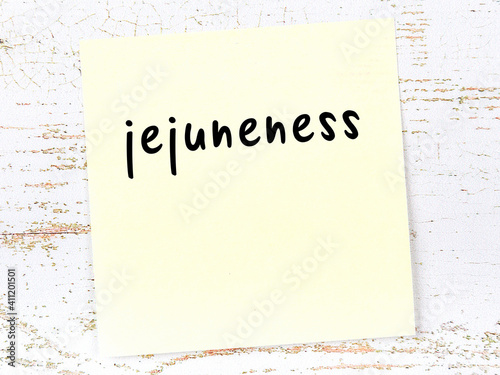 Yellow sheet of paper with word jejuneness. Reminder concept photo