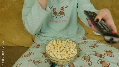 Girl Eating Popcorn And Watching TV