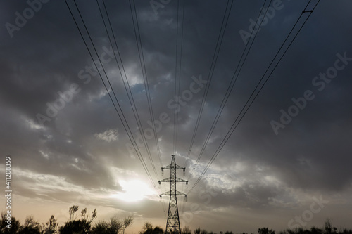 The last rays of the sun on some high voltage towers in Boadilla del Monte. Madrid's community. Spain photo