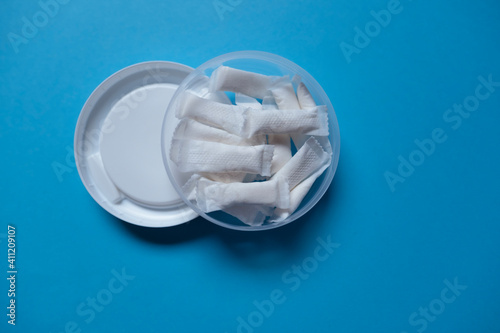 White portion Snus in a Box on a blue background