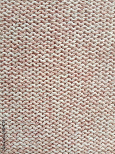 Pink knitting wool pattern background and texture 