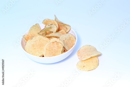 Delicious potato chips, isolated on white background 