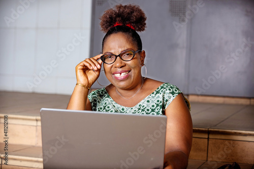 portrait of a beautiful mature woman with laptop.