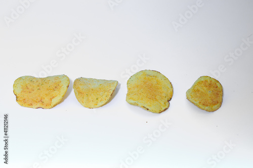 Delicious potato chips, isolated on white background 