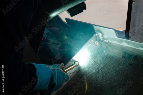 Welding Worker / Welder Doing Aluminium Weld