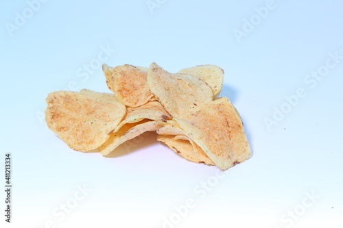 Delicious potato chips, isolated on white background 