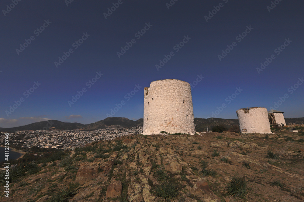 Turkey - Mugla - Historical windmills and city view in Bodrum city.