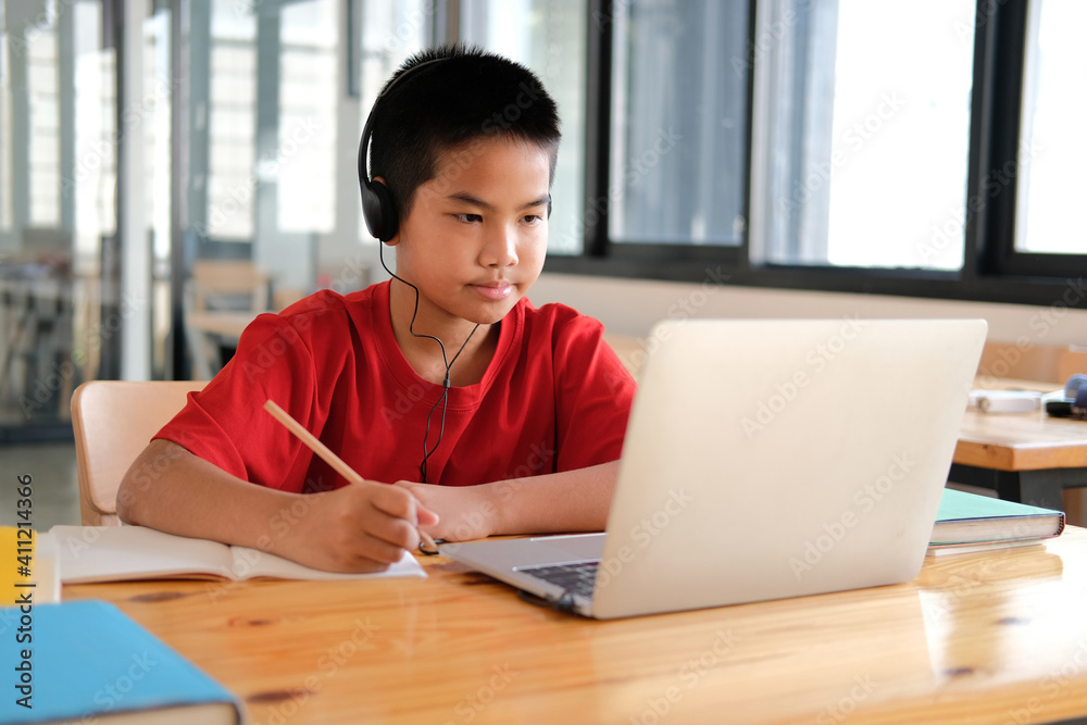 boy student studying learning lesson online. remote meeting distance education at home boy student studying learning lesson online. remote meeting distance education at home