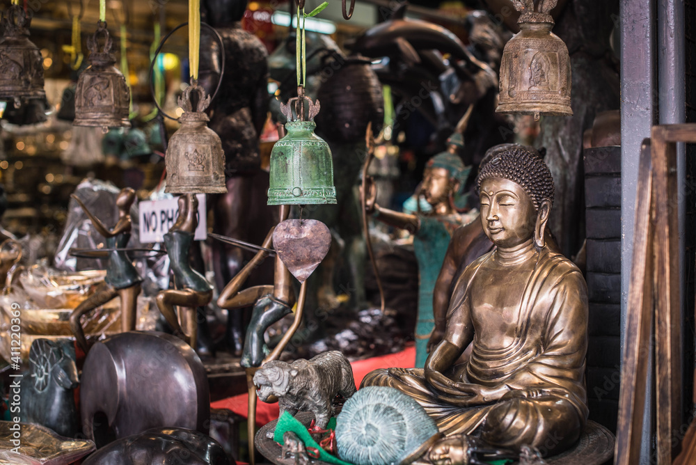 Collectible souvenirs and decorations for sale at Chatuchak Weekend Market in Bangkok, Thailand.