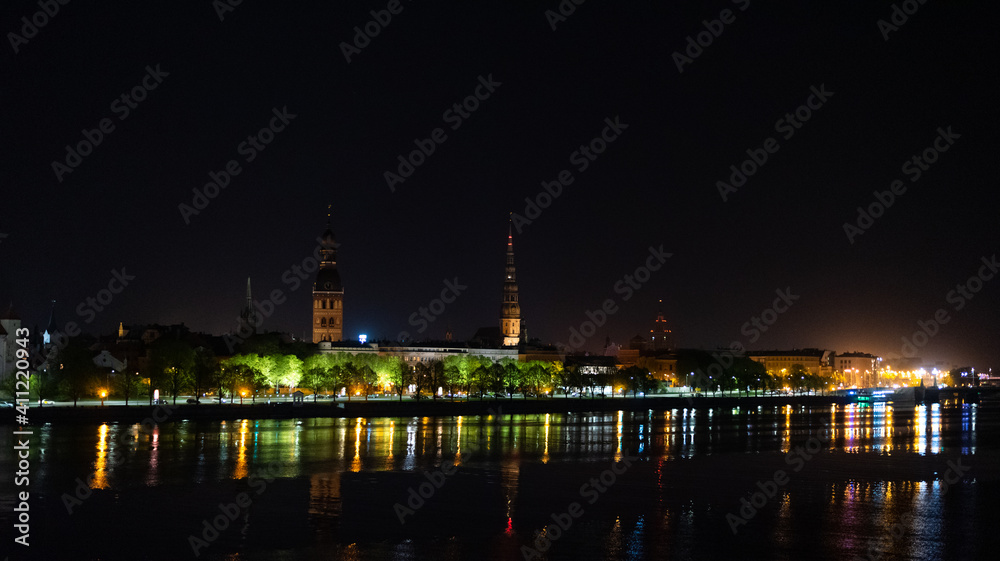 Riga city panoramic view across Daugava river at night Riga city panoramic view across Daugava river at night