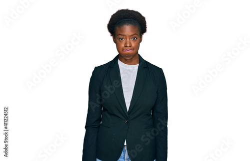 Young african american girl wearing business clothes puffing cheeks with funny face. mouth inflated with air, crazy expression.