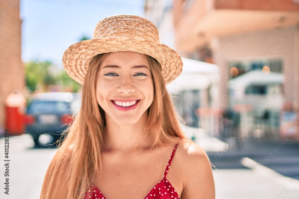 Young caucasian tourist girl smiling happy walking at the city.
