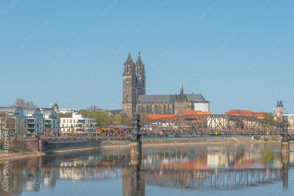 Historical downtown of Magdeburg, old town, Elbe river, and Magnificent Cathedral at early Spring with blue sky and sunny day, Magdeburg, Germany.