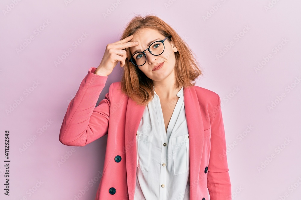 Young caucasian woman wearing business style and glasses worried and stressed about a problem with hand on forehead, nervous and anxious for crisis