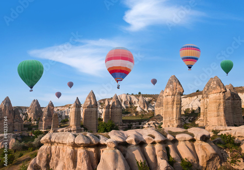 Colorful hot air balloons flying over Cappadocia in Love valley, Central Anatolia, Turkey. Nevsehir, Goreme National Park.
