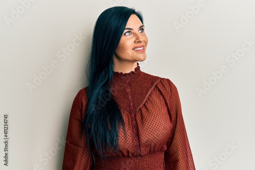 Young caucasian woman wearing casual clothes looking to side, relax profile pose with natural face and confident smile. © Krakenimages.com